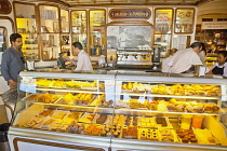 Portugal, Estremadura, Lisbon, Baixa district, Interior of Confeitaraia Nacional shop with tourists buying cakes.