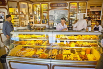 Portugal, Estremadura, Lisbon, Baixa district, Interior of Confeitaraia Nacional shop with tourists buying cakes.