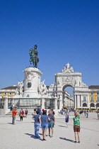 Portugal, Estremadura, Lisbon, Baixa, Praca do Comercio with equestrian statue of King Jose and Rua Augusta triumphal arch.