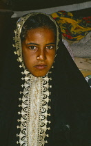 Qatar, General, Young girl wearing traditional head covering.