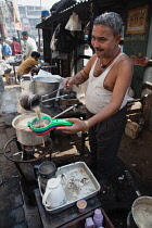 India, New Delhi, Chai vendor in the old city of Delhi.