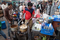 India, New Delhi, Chai vendor in the old city of Delhi.