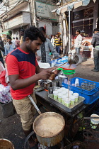 India, New Delhi, Chai vendor in the old city of Delhi.