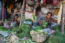 India, West Bengal, Kolkata, A vendor at Malik Ghat flower market.