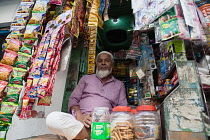 India, West Bengal, Kolkata, Muslim shopkeeper.