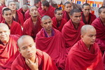 India, Bihar, Bodhgaya, Buddhist monks praying at the Mahabodhi Temple at Bodh.