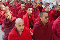 India, Bihar, Bodhgaya, Buddhist monks praying at the Mahabodhi Temple at Bodh.