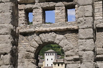 Italy, Valle d'Aosta, Aosta, city through ruins of Roman Theatre.