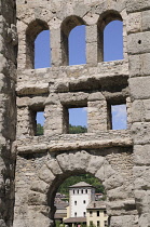 Italy, Valle d'Aosta, Aosta, city through ruins of Roman Theatre.