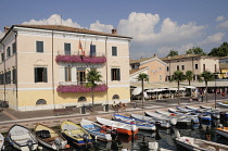 Italy, Veneto, Lake Garda, Bardolino, harbour front with fishing boats.