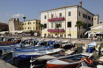 Italy, Veneto, Lake Garda, Bardolino, harbour front with fishing boats.