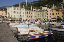 Italy, Lombardy, Lake Garda, Gargnano, harbour with boats & waterfront.