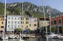 Italy, Lombardy, Lake Garda, Gargnano, harbour & waterfront buildings.