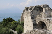 Italy, Lombardy, Lake Garda, Sirmione, Grotte di Catullo, Roman ruins of settlement with lake views.