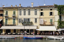 Italy, Veneto, Lake Garda, harbour front with cafes.