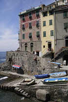 Italy, Liguria, Cinque Terre, Riomaggiore, harbour houses & fishing boats.