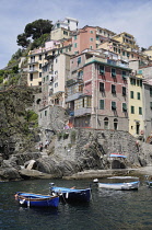 Italy, Liguria, Cinque Terre, Riomaggiore, harbour houses & fishing boats.