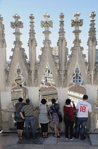 Italy, Lombardy, Milan, taking in the view, Duomo rooftop.