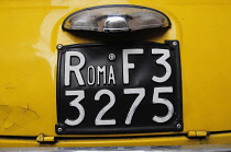 Italy, Lazio, Rome, Roma yellow number plate.