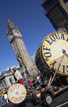 Ireland, North, Belfast, St Patricks Day parade passing the Albert clock on the corner of High Street and Victoria Street.