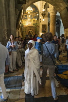 Israel, Jerusalem, An Ethiopian Christian pilgrim visiting the Church of the Holy Sepulchre in the Christian Quarter of the Old City of Jerusalem. The Old City of Jerusalem and its Walls is a UNESCO W...