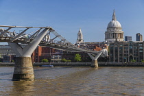 England, London, Early morning view of the Millennium Bridge and the River Thames looking towards St Paul's Cathedral.