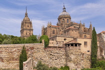 Spain, Castile and Leon, Salamanca, Cathedral of the Assumption of the Virgin Mary rising above the city walls.