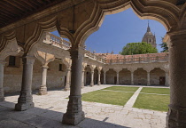 Spain, Castile and Leon, Salamanca, University of Salamanca, the Patio de Escuelas Menores courtyard with the dome of Salamanca Cathedral in the background.