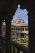 Spain, Castile and Leon, Salamanca, Convento de las Duenas  which is a Dominican convent built in the 15th and 16th centuries, Salamanca Cathedral framed with the arches of the upper cloister.