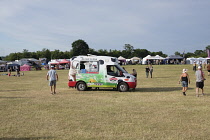 England, Surrey, Guildford, Guilfest, Ice cream van in middle of almost empty  festival field.