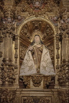 Spain, Castile and Leon, Avila, Basilica de Santa Teresa, statue of the saint inside the basilica.