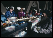 Uzbekistan, Tashkent, Old man eating horse meat sausage in Alaiski Bazaar