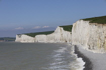 England, East Sussex, Birling Gap, View along pebble beach with Seven Sisters white chalk cliffs