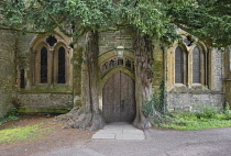 England, Gloucestershire, Stow on the Wold, St Edward's Church, North door flanked by yew trees said to have inspired Tolkien's Doors of Durin in Lord of the Rings.