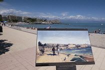 France, Provence-Alpes-Cote d'Azur, Antibes, Old town ramparts and coastline, sign with painting on Plage du Ponteil.