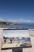 France, Provence-Alpes-Cote d'Azur, Antibes, Old town ramparts and coastline, sign with painting on Plage du Ponteil.