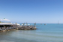 France, Provence-Alpes-Cote d'Azur, Antibes, Jetty with cafe bar on Plage du Ponteil.