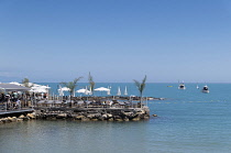 France, Provence-Alpes-Cote d'Azur, Antibes, Jetty with cafe bar on Plage du Ponteil.