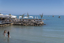 France, Provence-Alpes-Cote d'Azur, Antibes, Jetty with cafe bar on Plage du Ponteil.