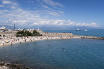 France, Provence-Alpes-Cote d'Azur, Antibes, People sunbathing on Plage de la Gravette.