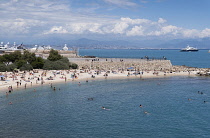 France, Provence-Alpes-Cote d'Azur, Antibes, People sunbathing on Plage de la Gravette.