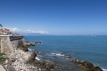 France, Provence-Alpes-Cote d'Azur, Antibes, Old town ramparts and coastline, looking toward the Picasso museum from Av. du General Maiziere.