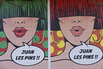 France, Provence-Alpes-Cote d'Azur, Antibes, Juan-les-Pins, Colourful posters on exterior of building.