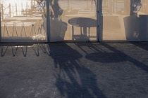 France, Provence-Alpes-Cote d'Azur, Antibes, Juan-les-Pins, Shadows cast by setting sun through restaurant screens.