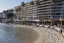 France, Provence-Alpes-Cote d'Azur, Antibes, Juan-les-Pins, People on sandy beach.