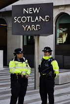 England, London, Whitehall Place, Women police officers outside New Scotland Yard.