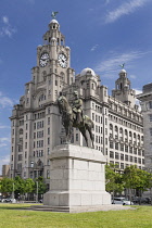 England, Lancashire, Liverpool, Pier Head, the Royal Liver Building which is one of Liverpool's Three Graces with an equestrian statue of King Edward V11 in the foreground.