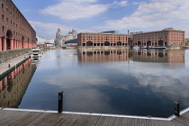 England, Lancashire, Liverpool, Royal Albert Dock with the Three Graces in the background.