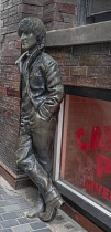 England, Lancashire, Liverpool, Statue of Beatle John Lennon outside the Cavern Club that became closely associated with the Merseybeat in the 1960's and regularly played host to The Beatles in their...