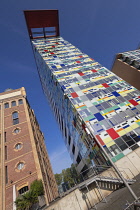 Germany, North Rhine-Westphalia, Dusseldorf, MedienHafen or Media Harbour area, The Colorium Building designed by British architect Will Alsop and standing 17 stories tall along the Rhine, catches the...